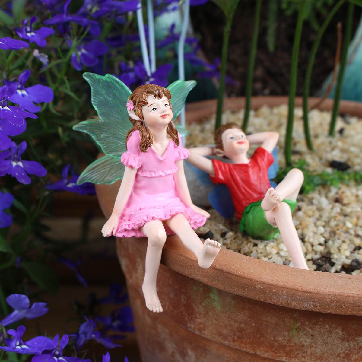 Fairy garden figurines sitting fairy girl and boy