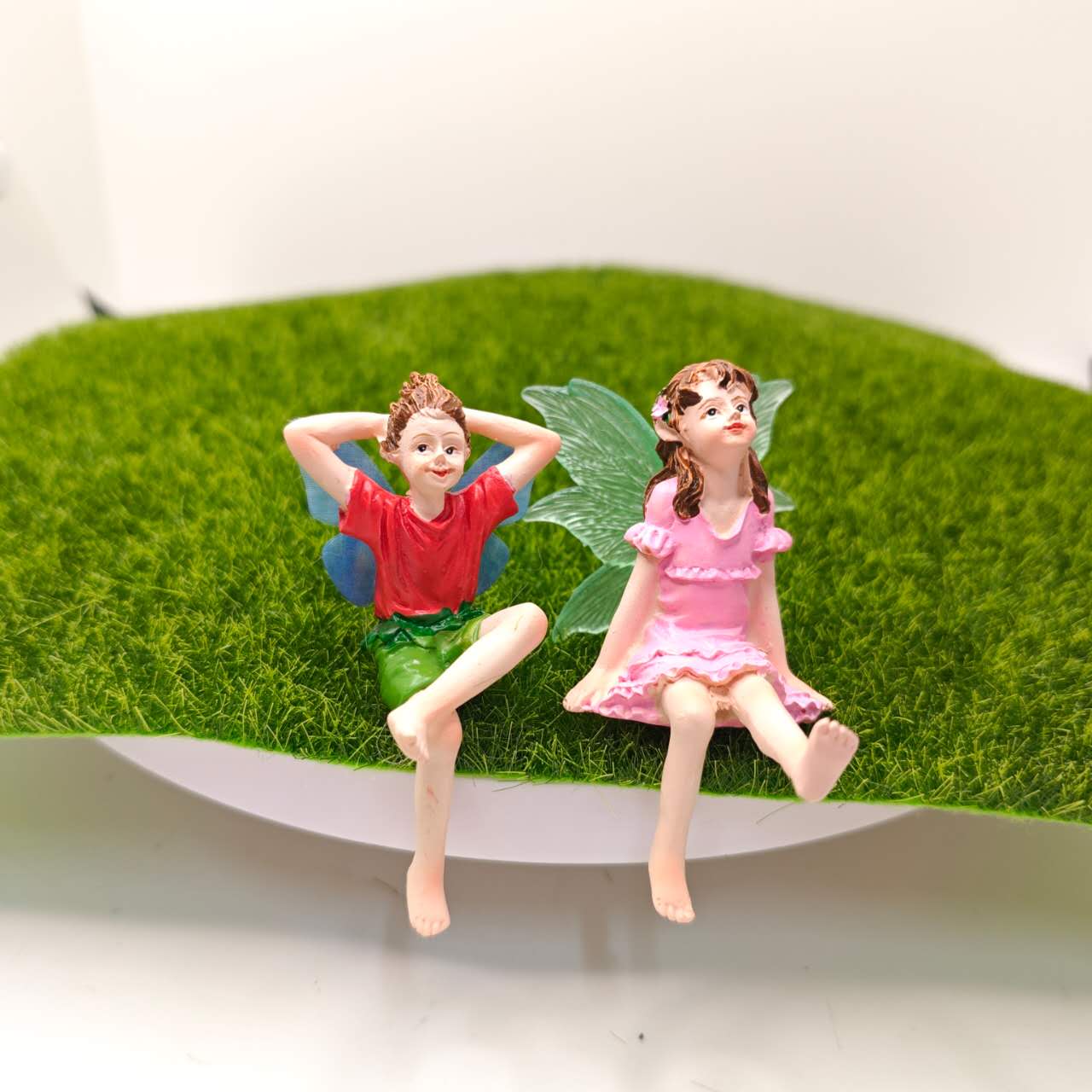 Fairy garden figurines sitting fairy girl and boy